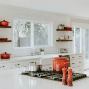 This Connecticut Kitchen remodel focuses on natural lighting and minimalist features, letting the brightly colored pots and pans be a color accent.