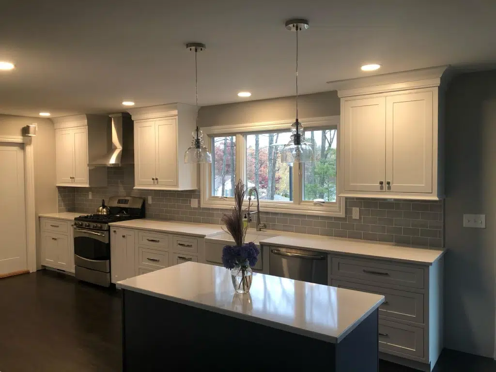 Recently remodeled kitchen in Connecticut with recessed lighting and granite countertops.