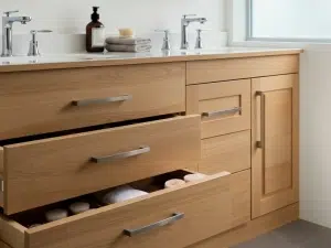 CT bathroom remodelers add storage solutions for a CT home. Renovation project by Kitchen Traditions improves functionality.