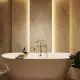 This updated CT bathroom design features a free-standing soaking tub, wall panel lighting, and a rainfall shower head. Bathroom makeover by Kitchen Traditions.
