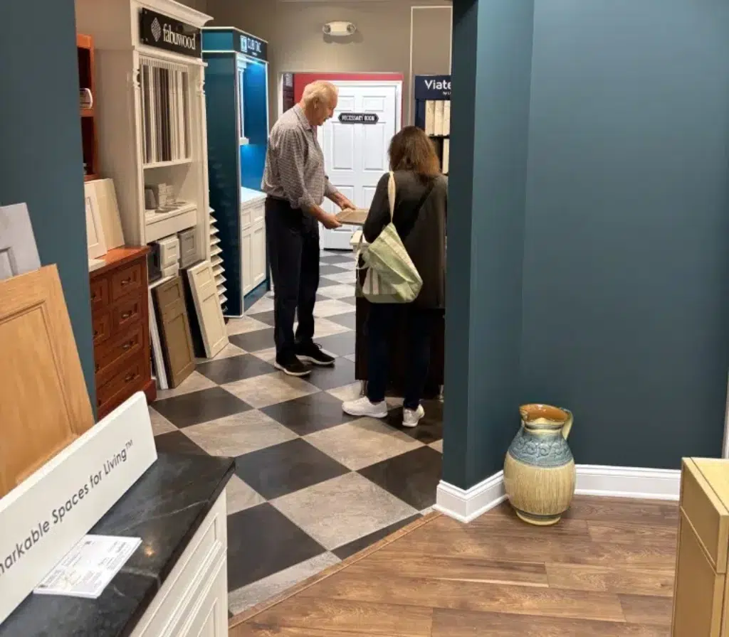 designer-guide-build Kitchen design-build contractor in CT helps a customer with material choices before beginning a kitchen update.