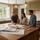 A kitchen remodeling contractor in Fairfield County, CT reviews blueprints and samples with homeowners while discussing how to plan a kitchen remodel in a dated, traditional-style kitchen.
